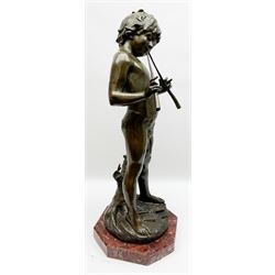 After Auguste Moreau (French 1834-1917): large bronze figure modelled as a young boy playing two pipes, standing upon a naturalistically modelled base detailed with tree stump and further pipe, signed Aug Moreau, upon octagonal red marble base, H72cm 