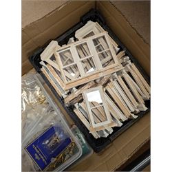 Dolls House building accessories, including three stair cases, a quantity of doors and windows, skirting board, coving, kitchen and fireplaces scenes and a collection of wired and non wired light fittings