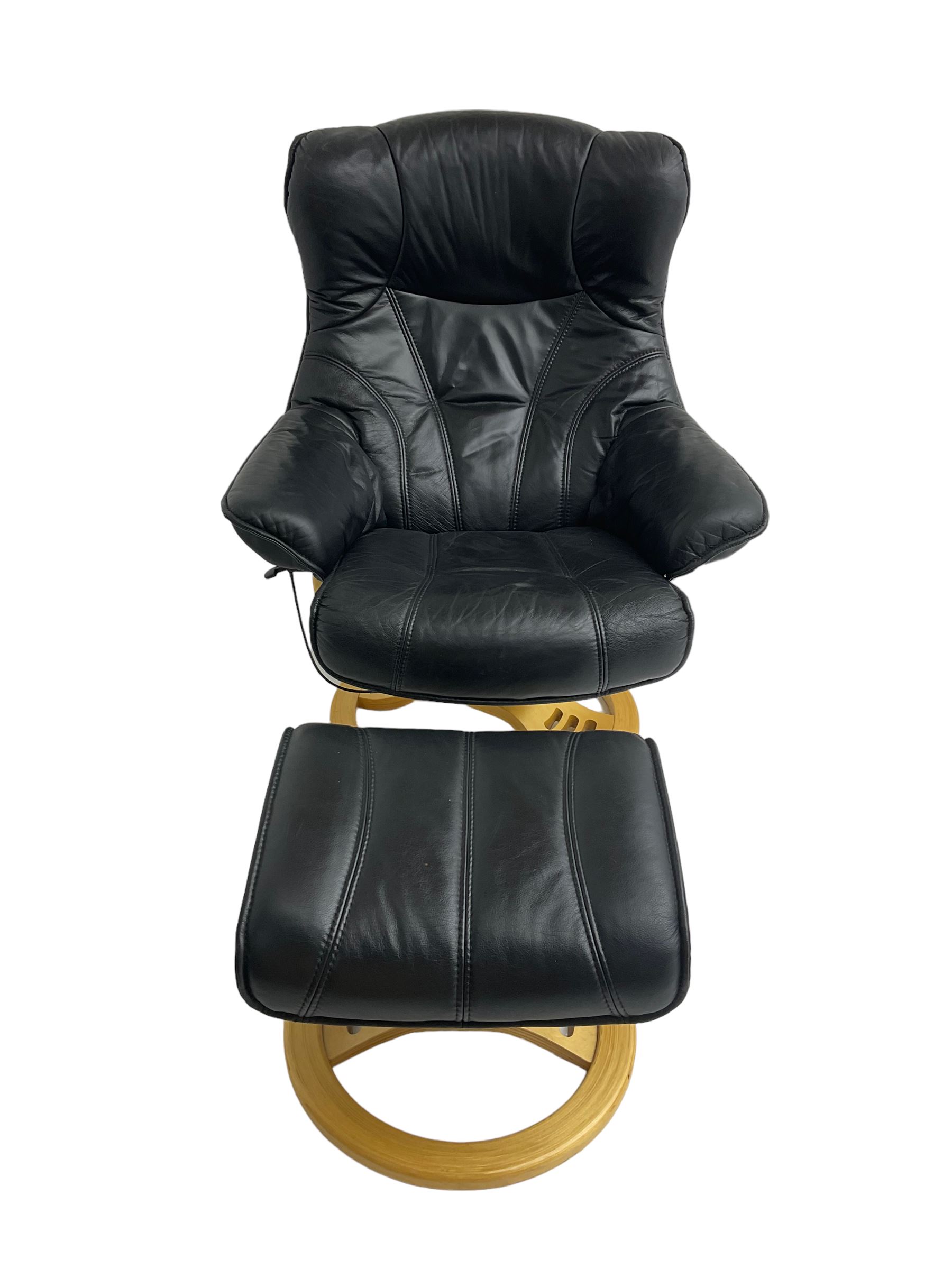 Anderssons of Sweden - mid-20th century design swivel armchair, upholstered black leather, raised on beech U-frame supports with circular base, together with matching footstool 
