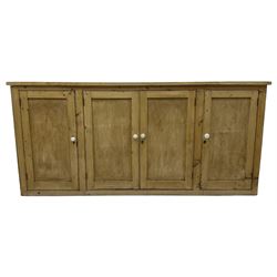 Victorian pine cupboard, rectangular top over four panelled doors, fitted with shelves