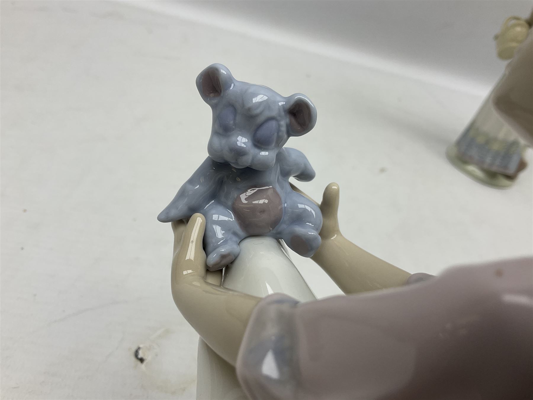 Three Lladro figures, comprising Garden Classic, signed no 7617, Summer Stroll no 7611 and Best Friend no 7620, all with original boxes, largest example H24cm 