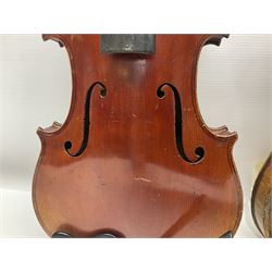 Late 19th century French three-quarter size 'Conservatory' violin with 34cm two-piece maple back and ribs and spruce top, the peg box inscribed 'Conservatory Violin Straduari', bears label 'Antonius Stradiuarius Cremonensis Faciebat Anno 1721' L55.5cm overall; in ebonised wooden 'coffin' case; and Saxony violin c1900 with 36cm two-piece maple back and ribs and spruce top; bears label 'Antonius Stradivarius Cremonensis Faciebat Anno 17**' L59cm overall; in carrying case (2)