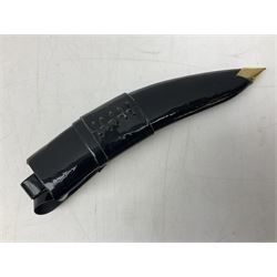 Ceremonial kukri, the 28.5cm curving blade inscribed 'O RDEP NEPAL 9/81' with brass mounted horn grip; in gloss black scabbard with two skinning knives 41cm overall