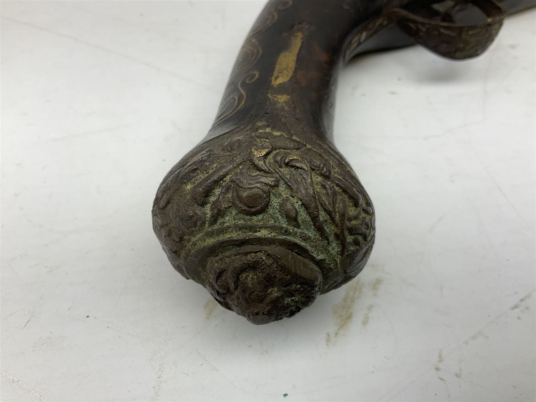 REGISTERED FIREARMS DEALERS ONLY - Reproduction flintlock pistol, the full walnut stock with brass filigree inlay and mounts and skull crusher butt L46cm; no visible proof marks - Disposed 25.06.25 - Notified 24.07.25