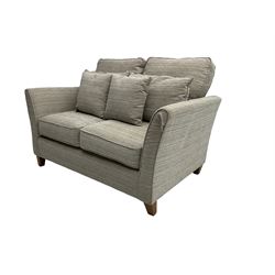 Two seat sofa, upholstered in textured cream and grey cord fabric, on square tapering feet