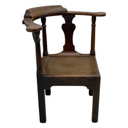 18th century oak corner elbow chair, the shaped cresting rail terminating to swept arm rests, supported by turned columns and vase-shaped splats, over square plank seat, raised on square-section supports