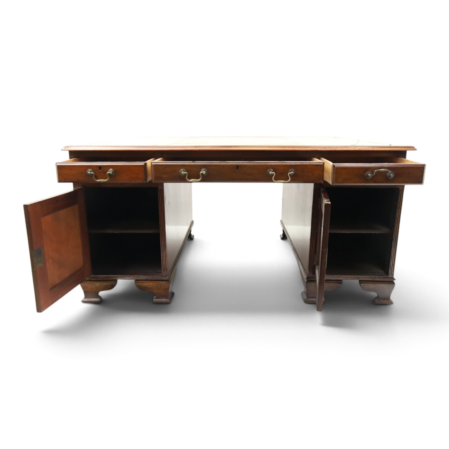 D Matthews & Son Office Furnishers (Liverpool) - Edwardian mahogany twin pedestal partners desk, rectangular top with inset green leather writing surface, fitted with an assortment of twelve drawers with brass swan neck handles, the pedestals with cupboards fitted to the opposing side, raised on ogee bracket feet