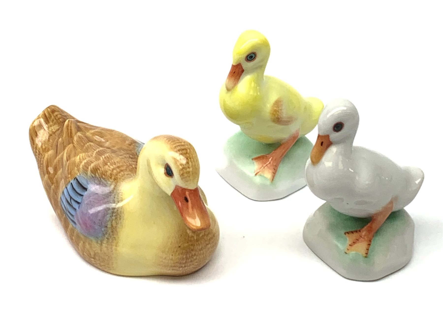 A Herend porcelain model of a Duck, together with two Herend Ducklings, each with printed mark beneath. 