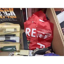 Mostly Queen and Freddie Mercury interest items, including pin badges, newspaper cuttings, diecast 'promotional' vehicles, special edition Pop Rocks figure of Freddie Mercury, VHS tapes, two charity certificates signed by Brian May and Roger Taylor, poster etc, in two boxes 