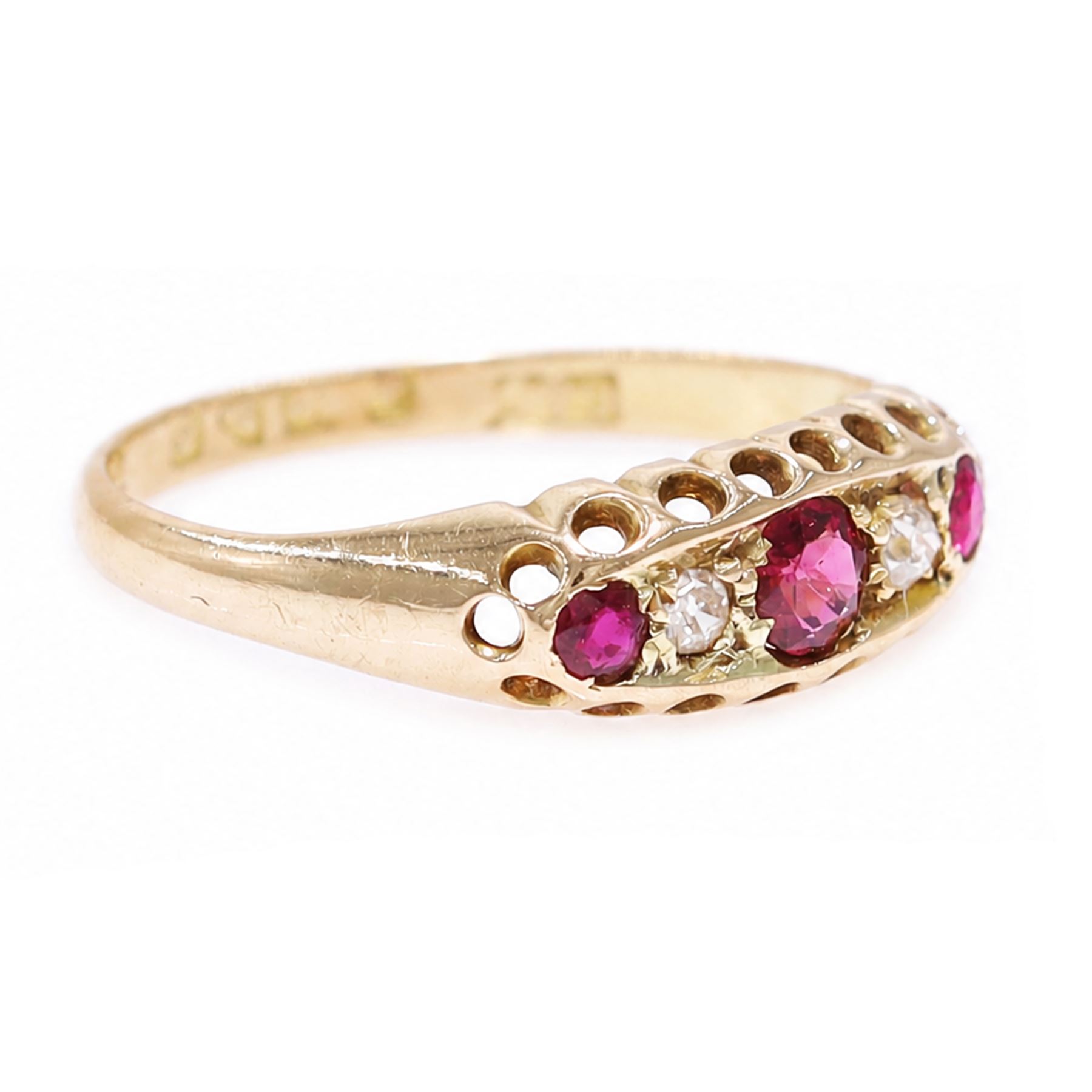 Early 20th century 18ct gold ruby and diamond ring, three round cut rubies, spaced by two old cut diamonds, Chester 1914, 
