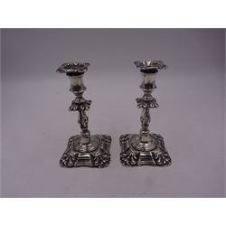 Pair of late Victorian silver mounted taper candlesticks, each of knopped and part fluted form, upon weighted square stepped base with anthemions to each corner, with conforming sconces, hallmarked Walker & Hall, Sheffield 1900, H11.8cm