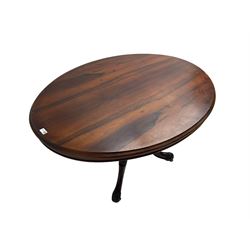 Victorian rosewood breakfast table, oval moulded tilt-top on quadruple turned pillar base, central turned finial, on four acanthus and scroll carved supports