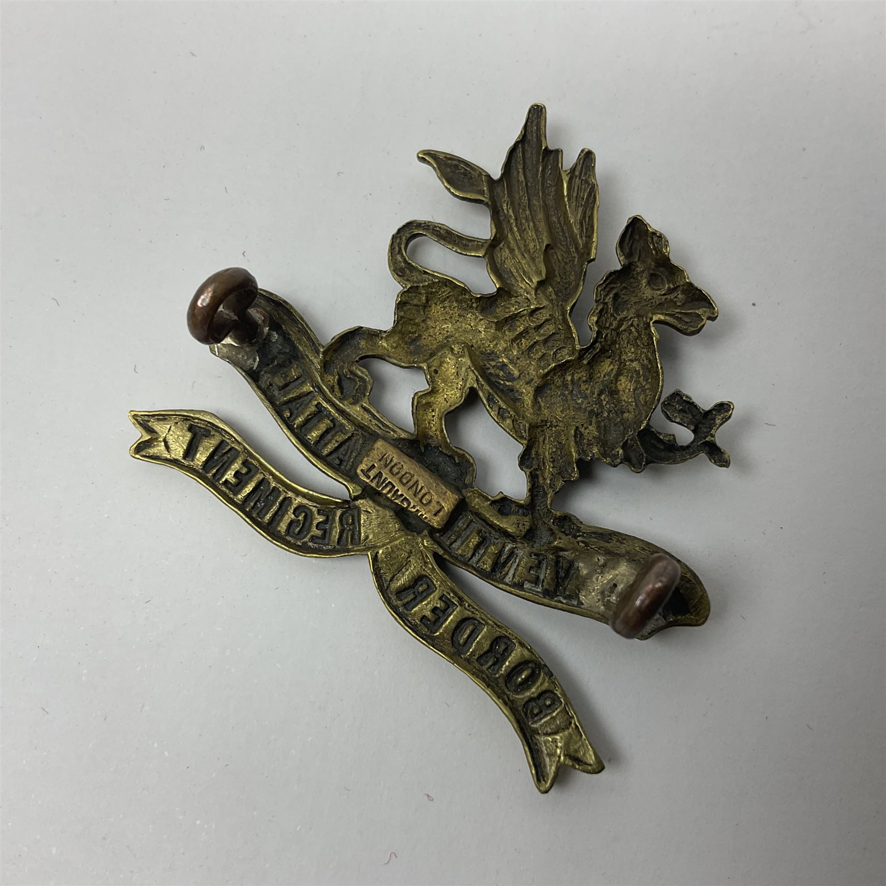 Four Border Regiment cap badges including eleventh battalion (4)