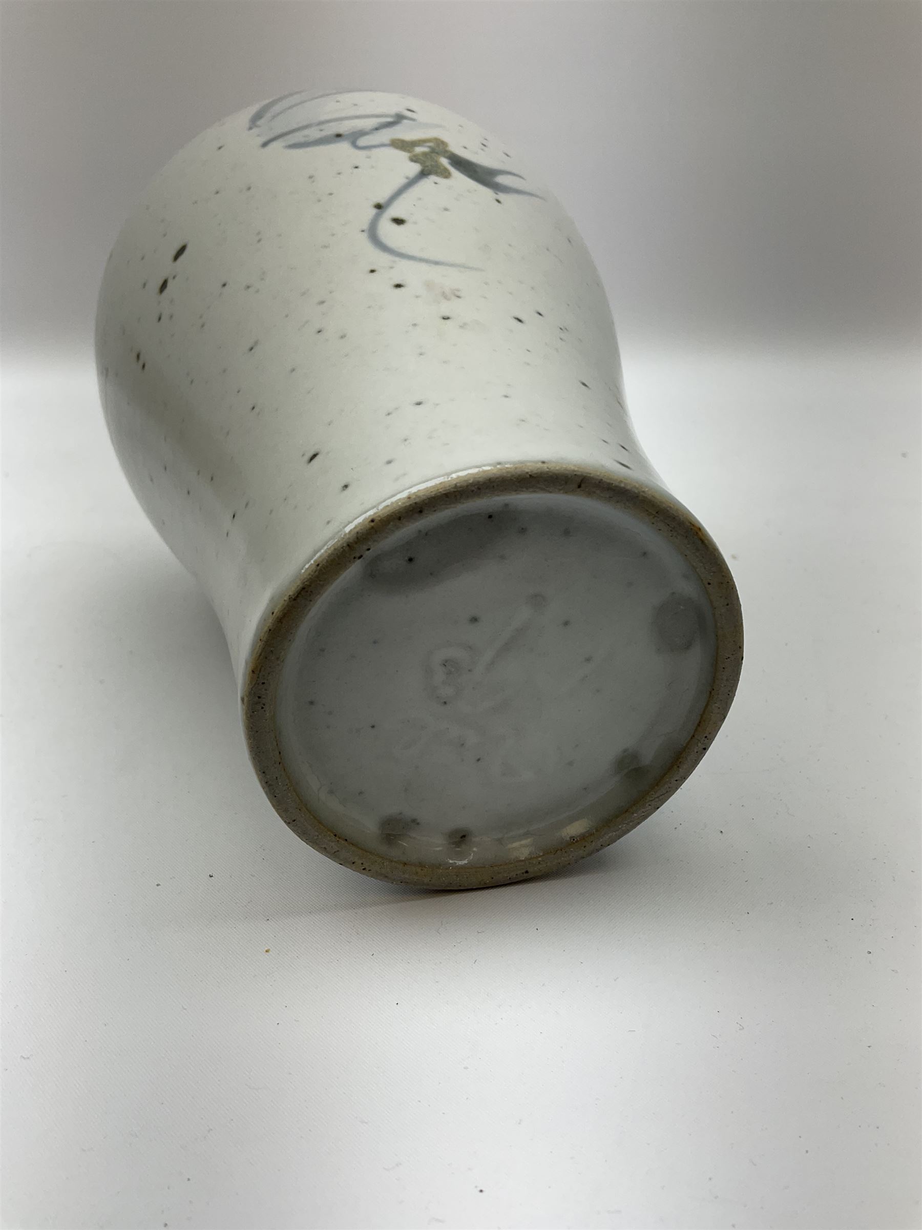 Studio pottery vase of baluster form with a light mottled blue ground with abstract painted decoration, H26cm