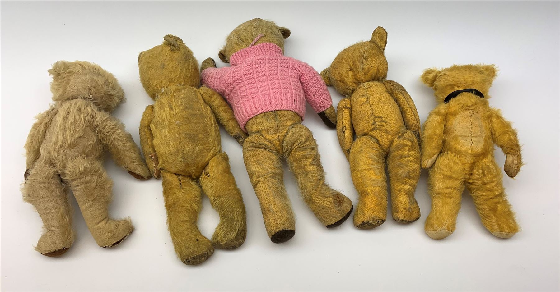 Five English teddy bears 1930s-50s including Chad Valley with swivel jointed head, glass type eyes and vertically stitched nose and mouth and jointed limbs with felt paw pads H14