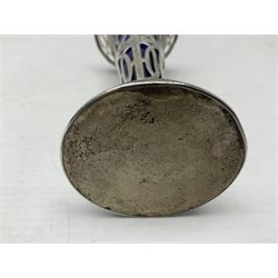 20th century silver specimen vase, of pierced trumpet form with flared rim, filled base, and blue glass liner, hallmarked Birmingham 
