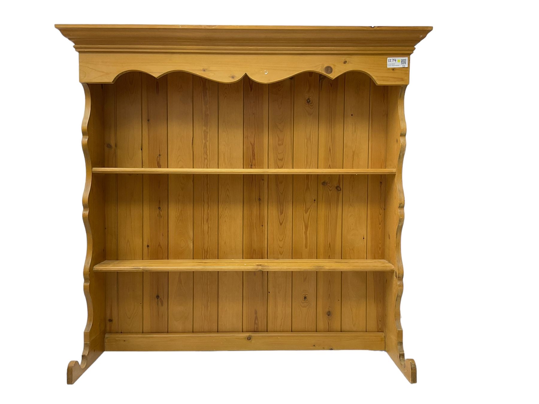 Pine media or television cabinet, enclosed by single glazed door (W56cm, H82cm, D43cm); pine corner cupboard, three shelves over single cupboard (W76cm, H188cm); pine two-tier plate rack with shaped frieze and uprights (W113cm, H107cm)