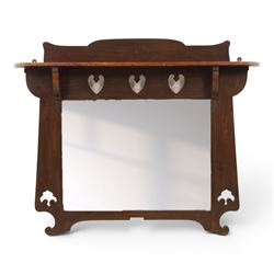 Arts and Crafts oak wall mirror, rectangular mirror plate within shaped frame, raised shel...