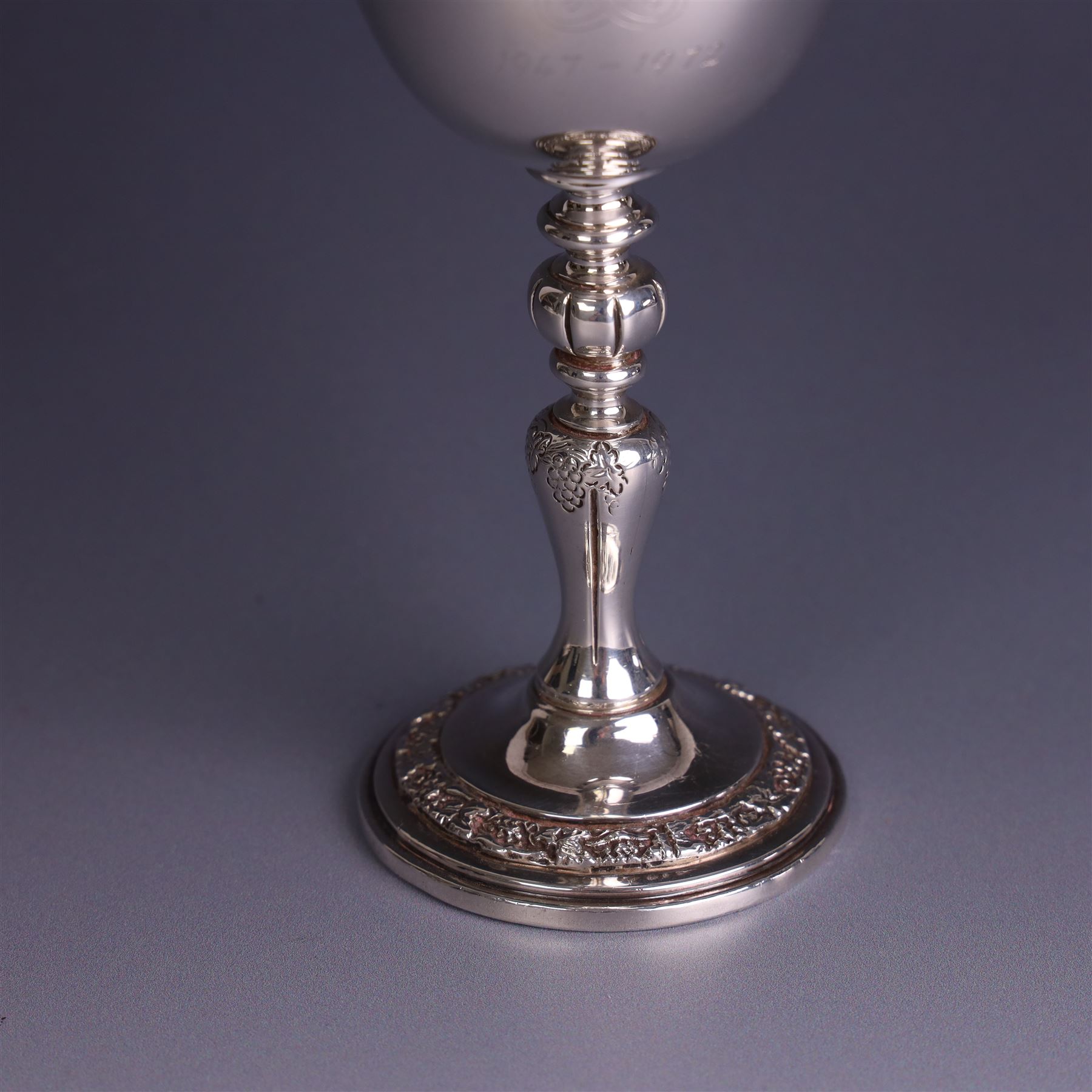 Late 20th century limited edition silver goblet, produced by Garrard & Co Ltd  to commemorate the silver wedding anniversary of Her Majesty Queen Elizabeth II and His Royal Highness the Duke of Edinburgh, the bowl engraved with Royal cyphers and anniversary dates, upon a knopped stem and embossed foot, no. 77/2000, hallmarked Garrard & Co Ltd, London 1972, H15cm