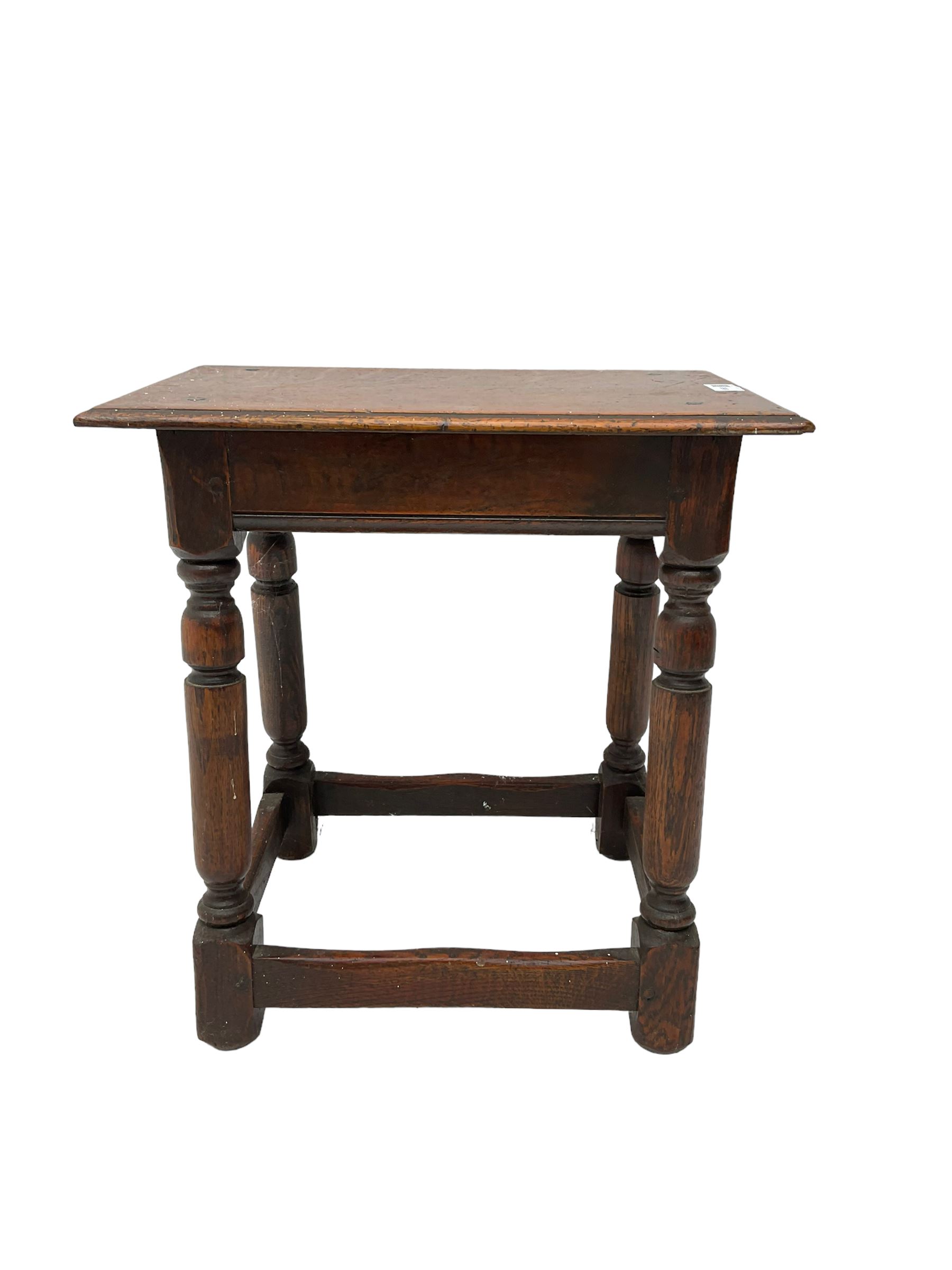 Oak coffin or joint stool, rectangular top with shaped edge over splayed turned supports with stretcher base 