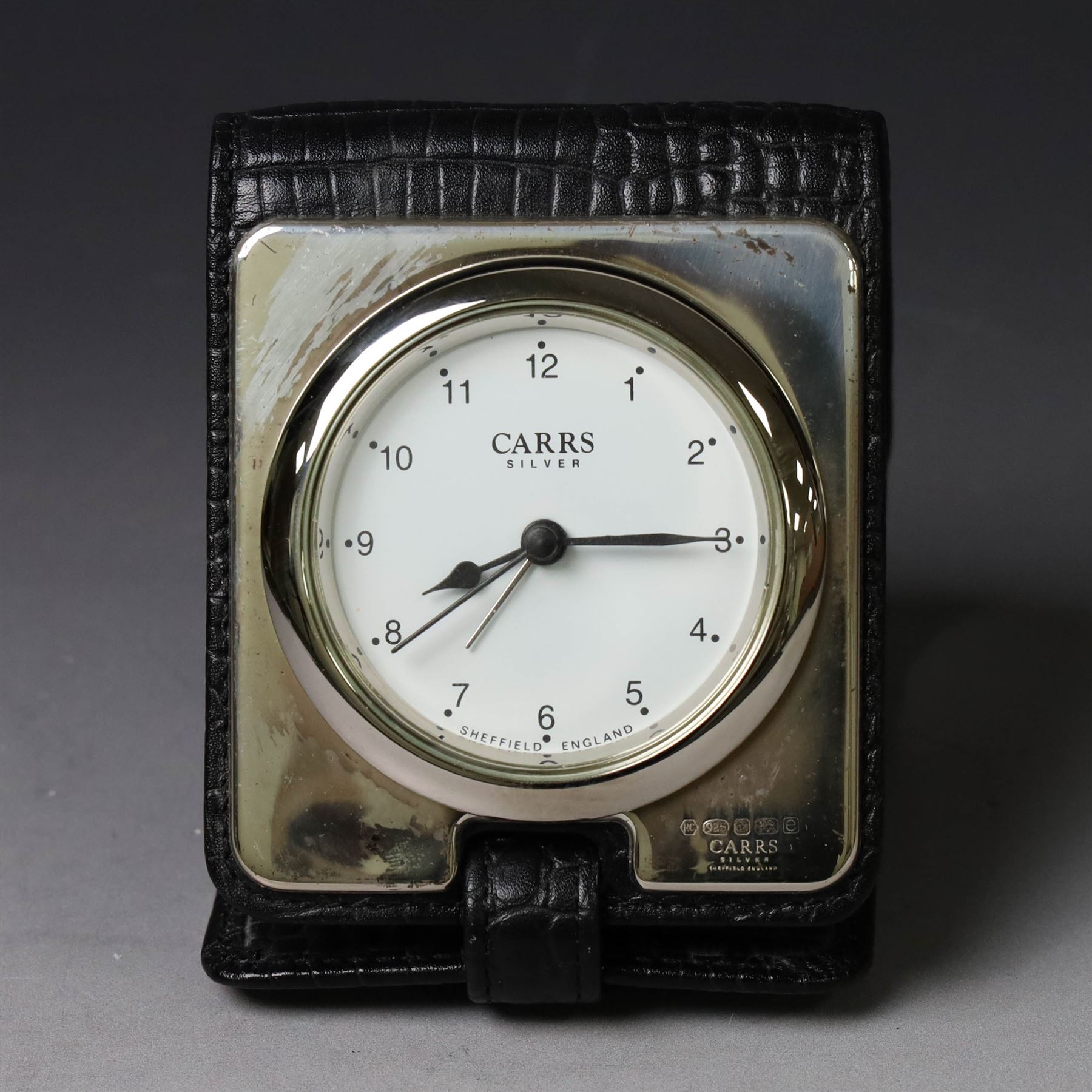 Silver mounted glass decanter, boxed with wooden plinth, together with a silver pepper grinder and a silver mounted Carrs desk clock, all hallmarked