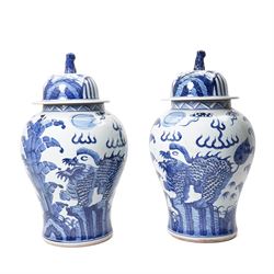 Pair of blue and white Chinese baluster vases and covers decorated with dragons, foliage etc H49cm