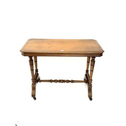 Late Victorian oak side table, moulded top, bobbin turned supports and stretcher, shaped feet and castors