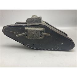 Large clockwork model of a WW1 Tank made of tin-plate and aluminium, with moving side cannons, the clockwork chain driven movement driving the articulated tin tracks; L28.5cms  W16.5cms and H13.5cms