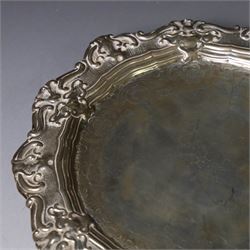 19th century continental silver waiter, of hexagonal form with stipple and scroll border, engraved with floral decoration to centre, upon three stylised paw feet, W19.2cm