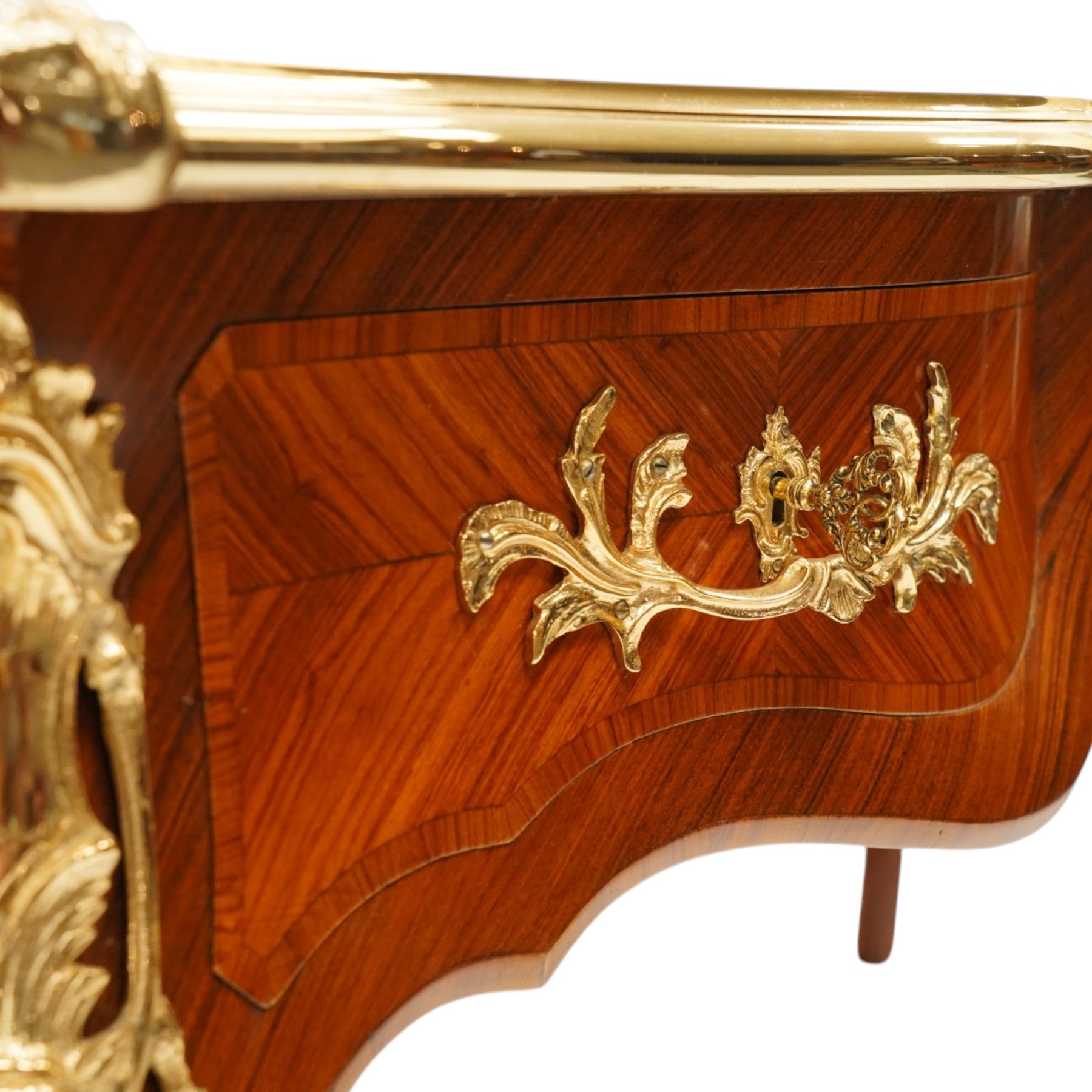 Baggio Anciens Meubles - Italian Louis XV style kingwood and gilt metal mounted bureau plat or writing desk, the shaped rectangular top with inset leather writing surface with gilt metal edge, above three shaped frieze drawers with gilt metal handles, raised on cabriole supports with gilt cartouche mounts to the knees and scroll feet