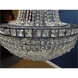  Contemporary cut glass and chrome twelve light chandelier, of inverted trumped form, with graduating circular tier base and hung faceted drops, H84cm x W59cm   