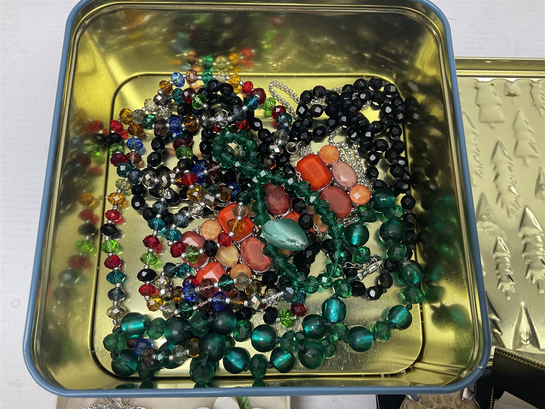 Silver ammonite pendant, silver earrings and a collection of beaded and other costume jewellery