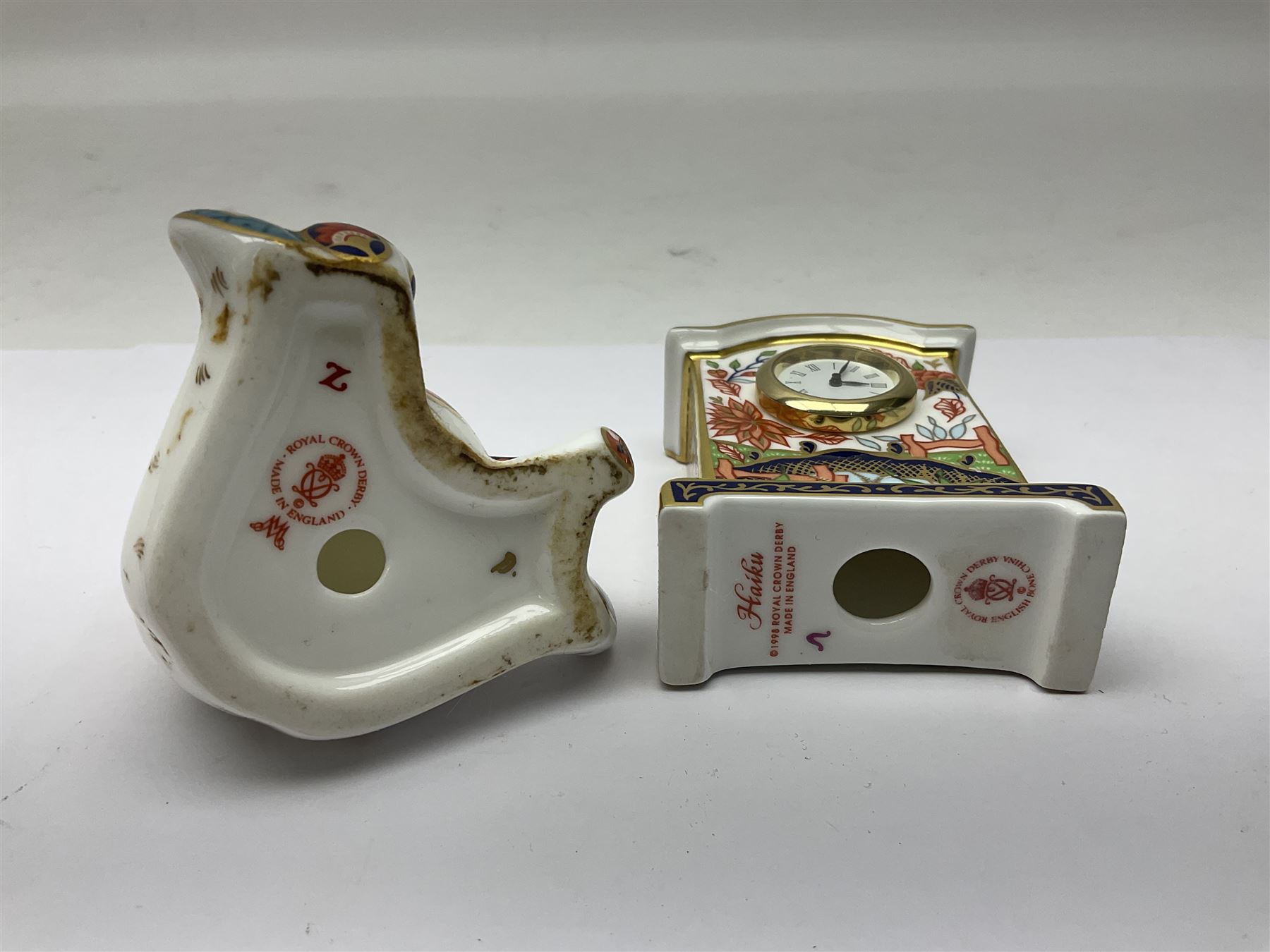Royal Crown Derby Haiku pattern miniature clock, together with 1128 Imari pattern trinket box with cover and teddy bear figure, all with printed marks beneath   
