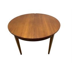 G-Plan - mid-20th century teak extending circular dining table, with concealed additional leaves (W114cm H72cm); and set four mid-20th century teak dining chairs, seat upholstered in beige fabric