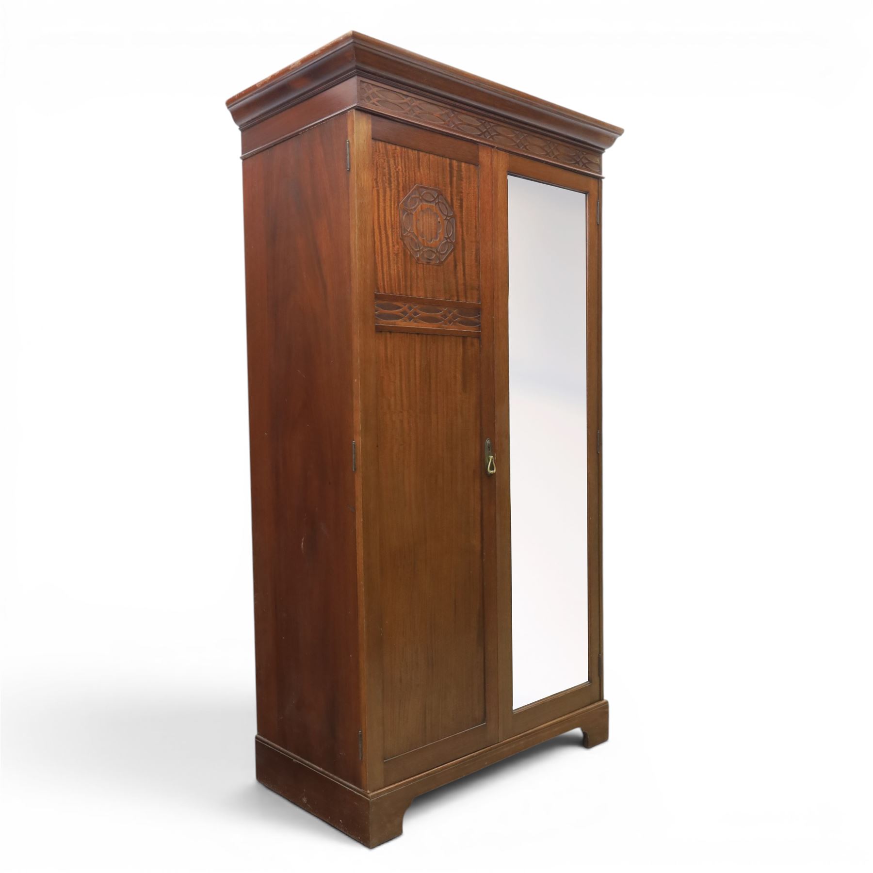 Quality Edwardian mahogany double wardrobe, featuring bevelled mirrored and panelled door with applied moulded detail, internal brass rail hanging and shoe rails