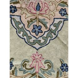 Small pastel prayer rug, cream field with Mihrab arch and trailing floral motifs in pink, blue, and green, bordered by floral patterns, knotted fringe to both ends