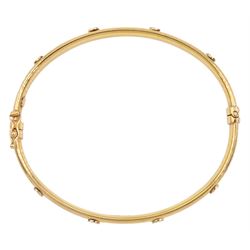 9ct gold hinged bangle with applied stud decoration, hallmarked
