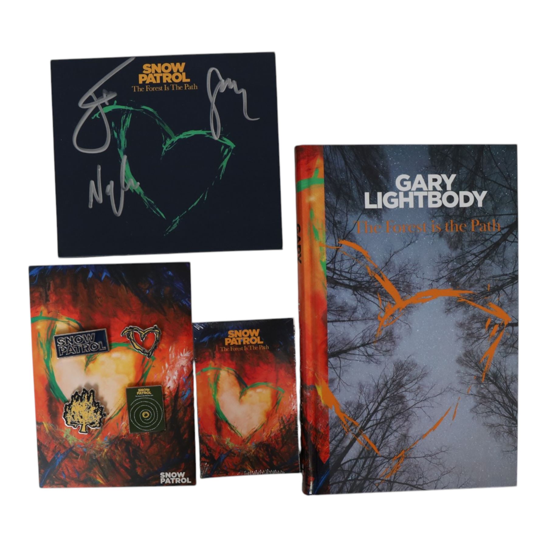 Snow Patrol memorabilia, including 'The Forest is the Path' book, art card and CD cover the book signed by  Gary Lightbody and the others signed by Gary Lightbody, Johnny McDaid and Nathan Connolly, together with Fallen Empires tour programme, tour advert, two tote bags, enamel pins, cassette and framed Chasing Cars gold coloured CD with printed signatures
