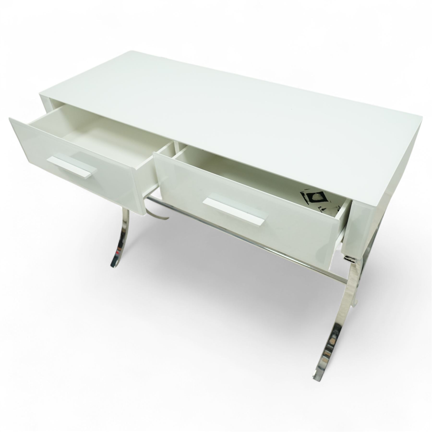 Contemporary white and chrome console dressing table, rectangular top over twin drawers with integral bar handles, raised on curving polished chrome supports united by a tubular stretcher