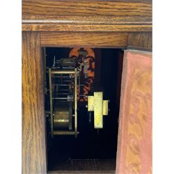 Winterhalder & Hofmeier- German 8-day oak cased mantle clock, in an architectural styled case with a gable pediment and recessed carving to the tympanum, square brass dial flanked by carved reeded pilasters and capitals, with open carved silk backed sound frets on a shaped plinth with padded feet, brass dial with cast spandrels and silvered chapter, Roman numerals, minute track and stylised gothic hands, conforming chime/silent and pendulum regulation dials, twin train going barrel movement with quarter-hour striking on two coiled gongs and the hours on one.
With pendulum.