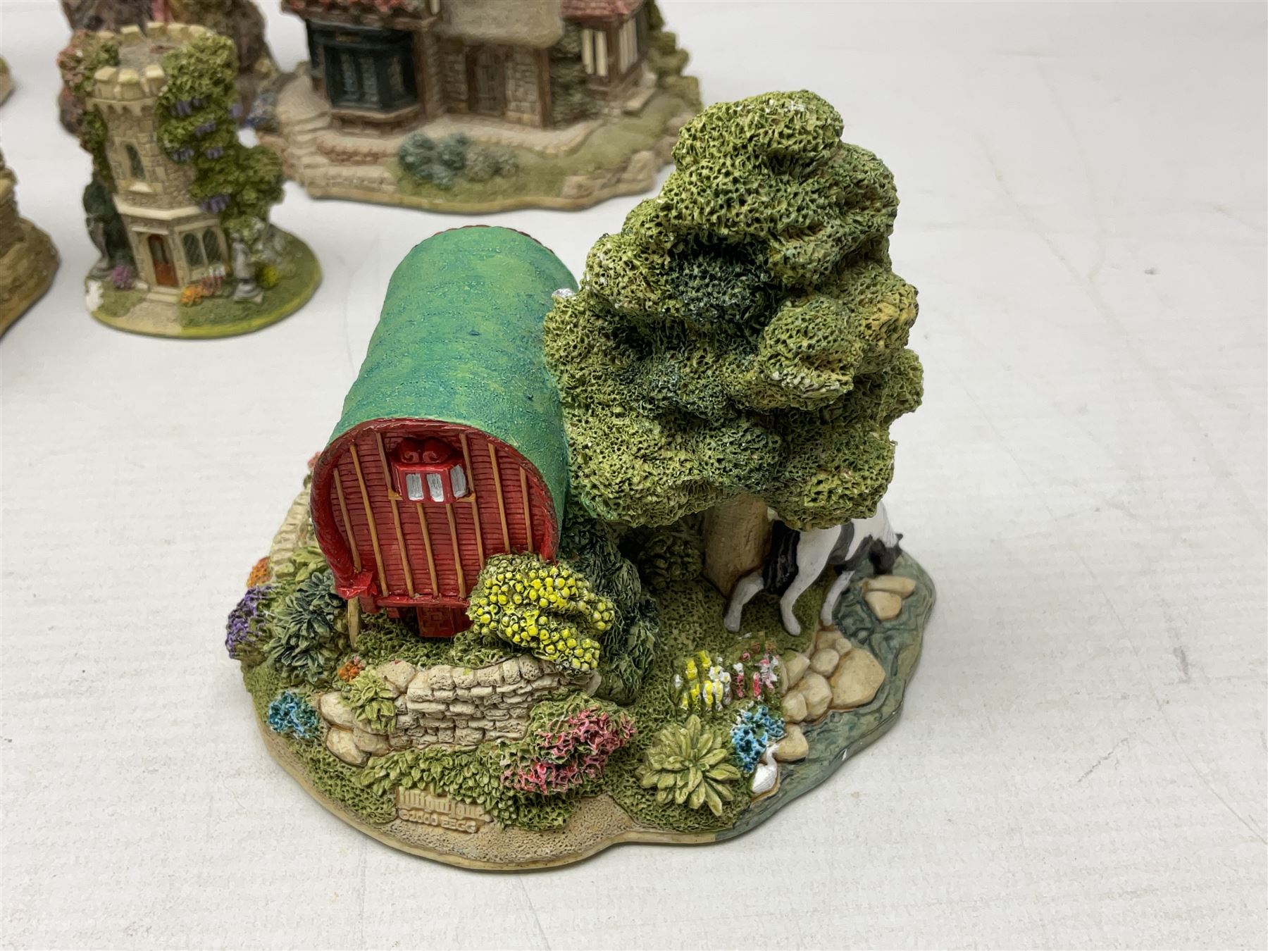 Sixteen Lilliput Lanes, to include The Golden Jubilee, Round Tower - Windsor Castle, Castle of the Golden Chalice, Travellers Rest, with box and deed,  Summer Days, Sunshine Creek, Writing with Lewis Carol, with box and deed,  etc 