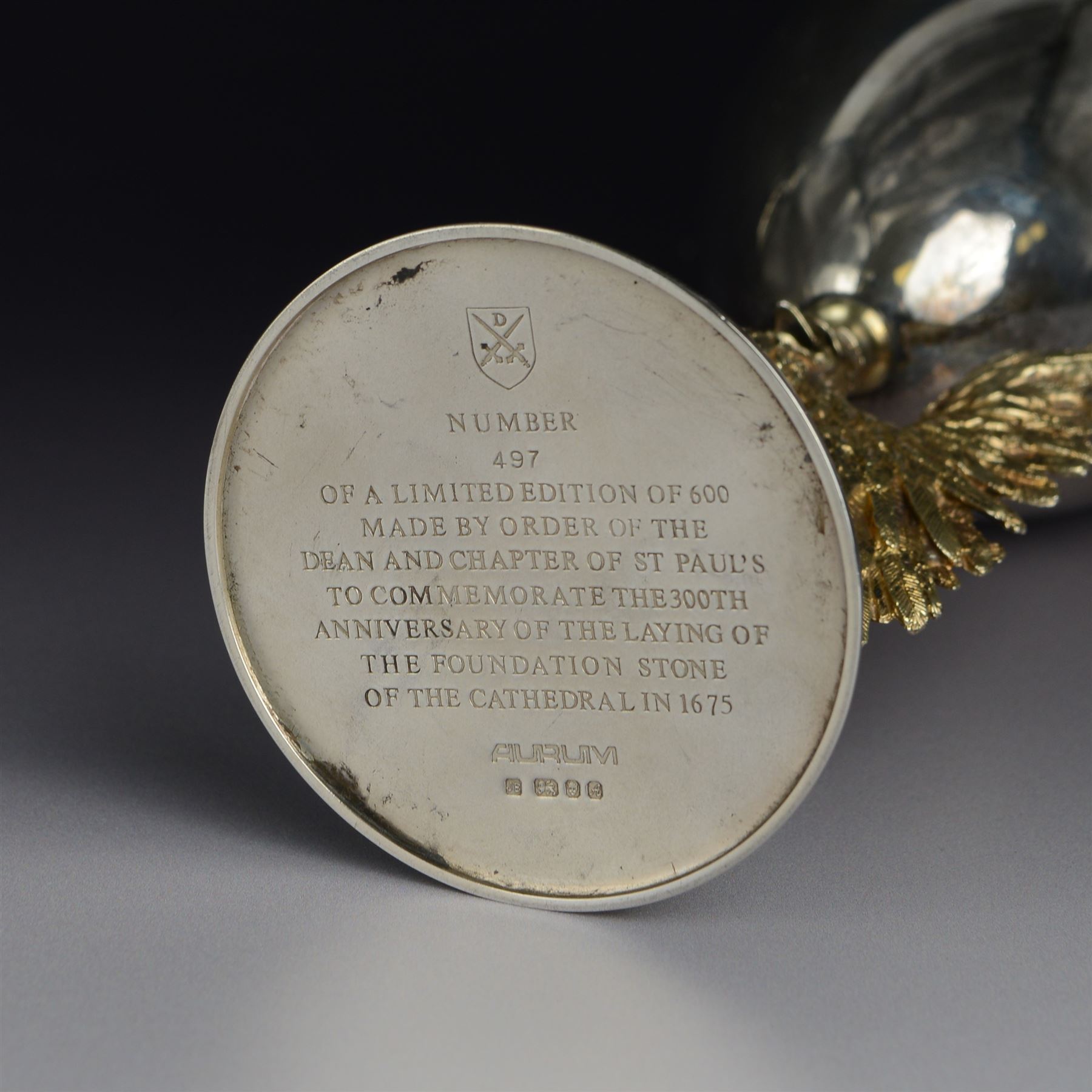 Modern limited edition silver goblet, 'made by order of the Dean and Chapter of St Paul's to commemorate the 300th anniversary of the laying of the foundation stone of the cathedral in 1675', designed by Jocelyn Burton for Aurum, the plain bowl with gilt interior, upon a parcel gilt stem in the form of a phoenix with wings outstretched,  limited edition no. 497, hallmarked Jocelyn Burton, London 1975, H16cm, boxed