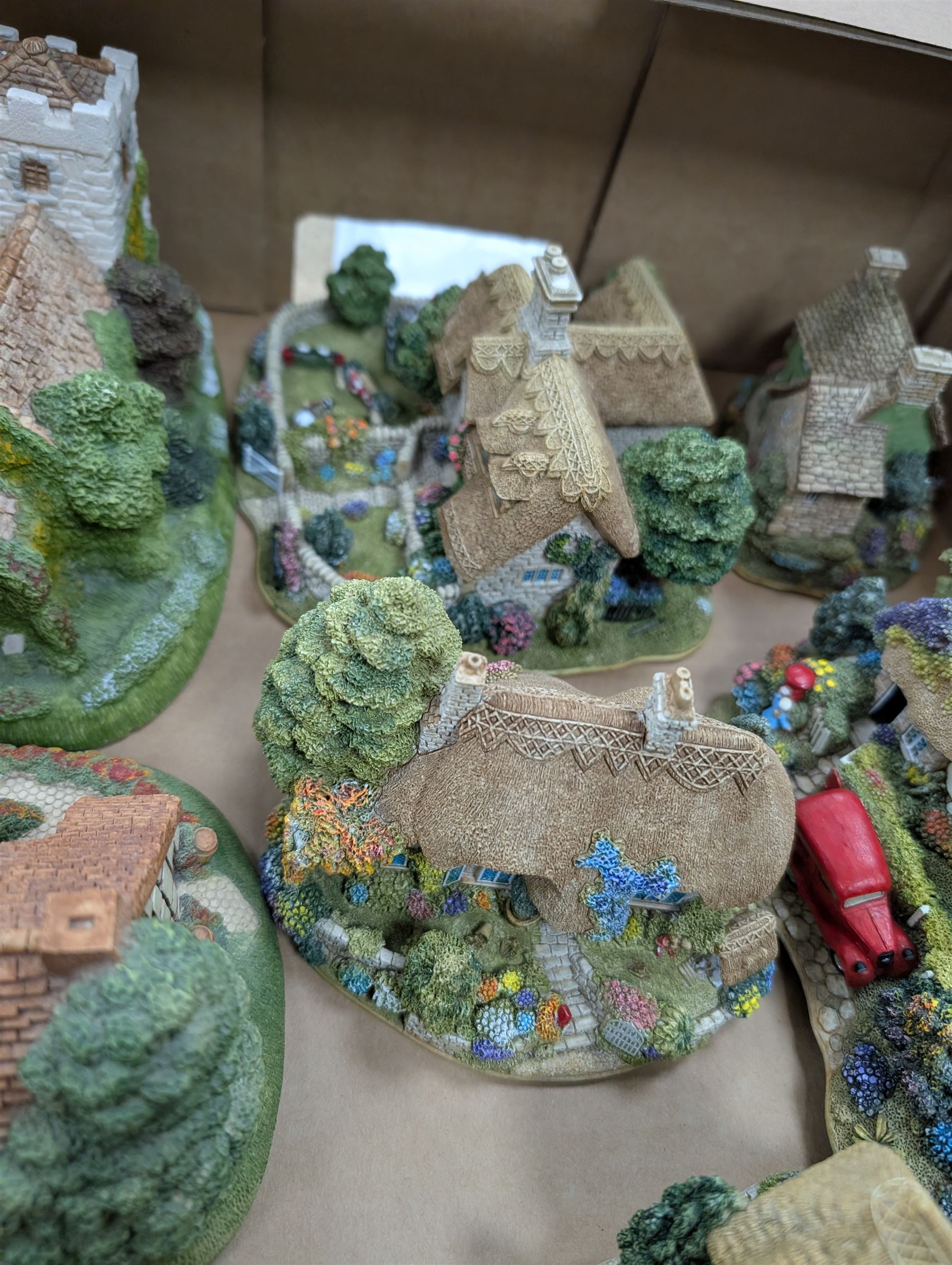 Six Lilliput Lane models, including The Old Mill at Dunster and Pen Pals, together with two Memory Lane models and two Lakeland Studios plaques, most with boxes