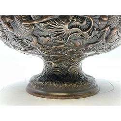 Large Chinese bronzed footed bowl, decorated in relief with dragons chasing the flaming pearl, with character mark beneath, H18.5cm D27.5cm