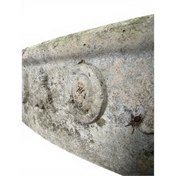 Cast stone planting circle, detailed with flower motifs and roundels