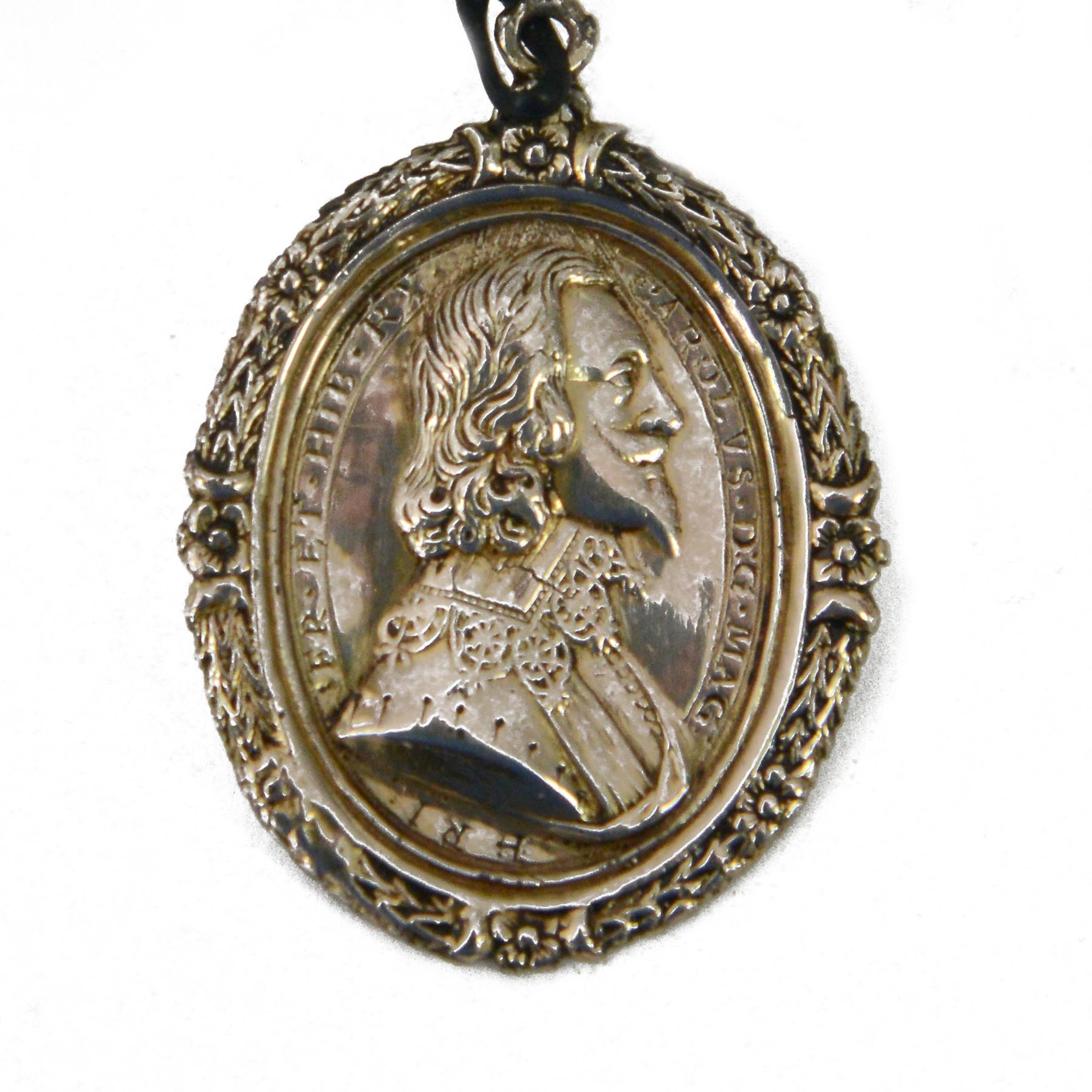 Charles I, silver gilt Royalist Badge, by Thomas Rawlins, Charles I in profile to right, lace collar and doublet, CAROLVS DG MAG BRI FR ET HIB RX, the reverse crowned shield of Royal arms, wreath border around to both sides, H5.2cm