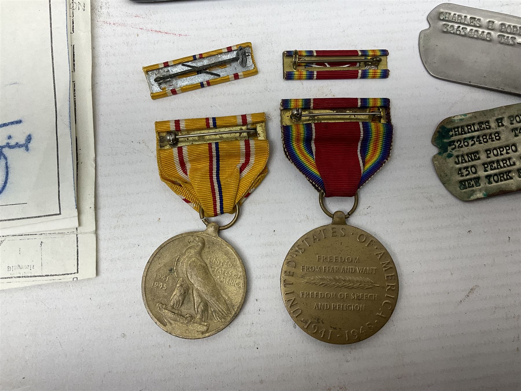 American Purple Heart Medal awarded to 32634848 Charles H. Poppo; cased with identity tags and paperwork; and Bronze Star Medal awarded to U.S. Marine Esteban T. Maranao; cased; American WWII Victory Medal and Asiatic Pacific Campaign Medal