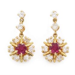 Pair of 18ct gold ruby and diamond pendant earrings, each stud set with a single round cut...
