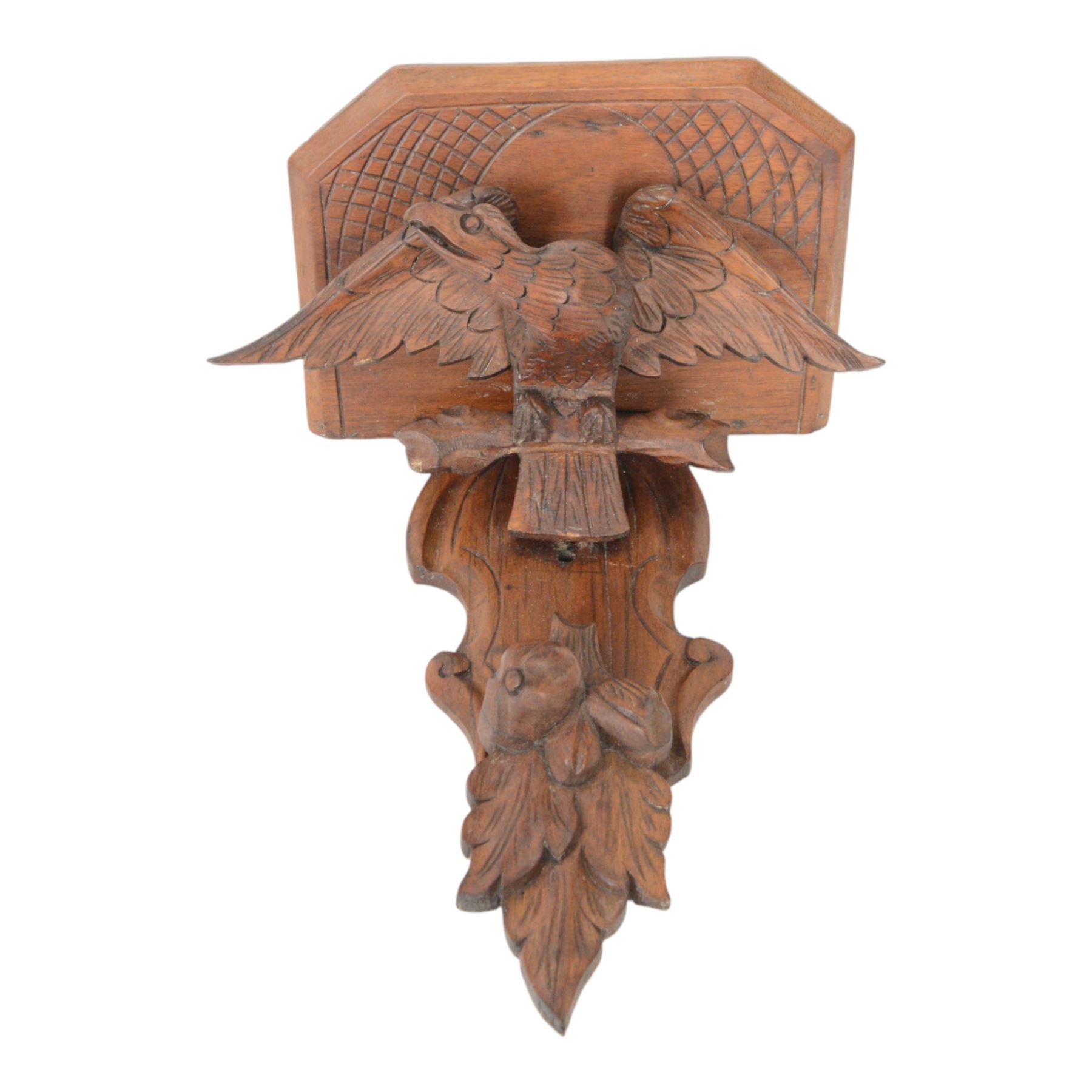Edwardian oak clock bracket, carved with an eagle support over fruiting foliage, H37cm