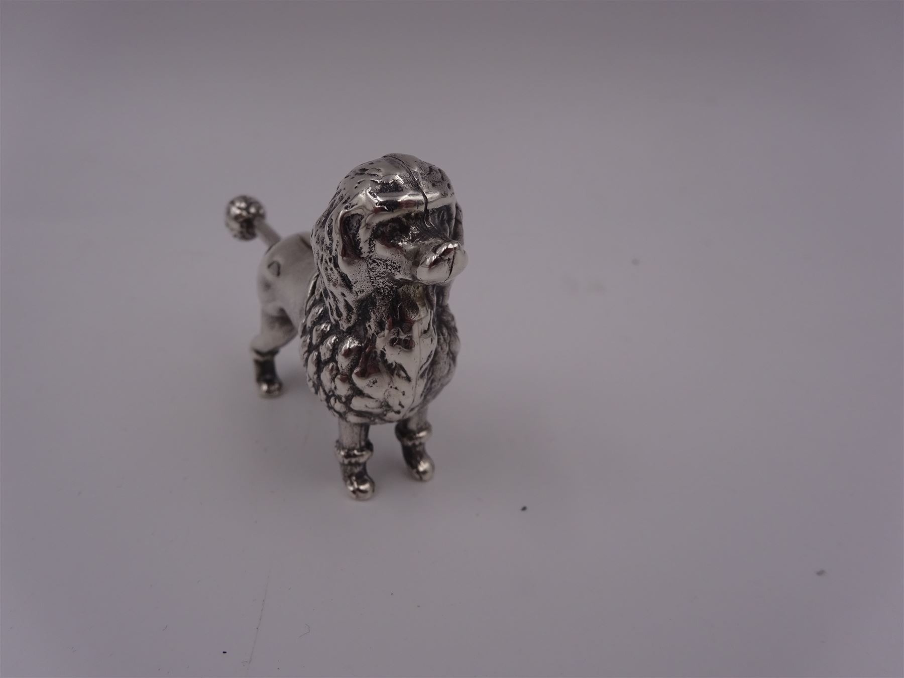 Modern silver novelty cigar cutter, modelled as a poodle, hallmarked, H4cm
